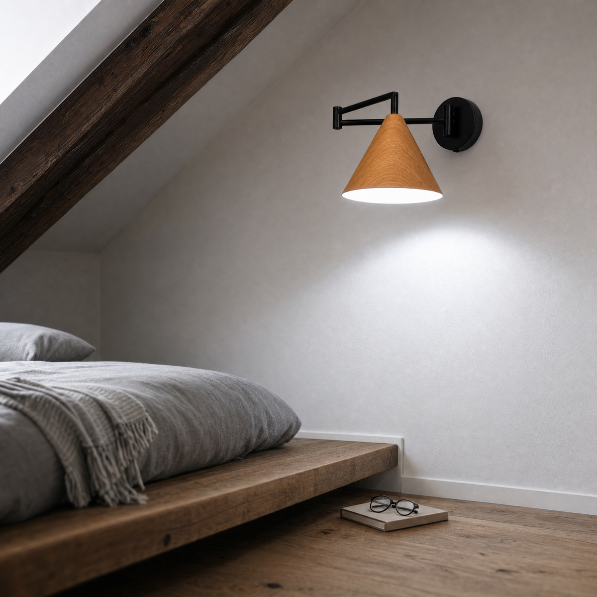 Soren Nordic Swing Arm Wall Sconce in Wood with white light in a loft bedroom with exposed beam