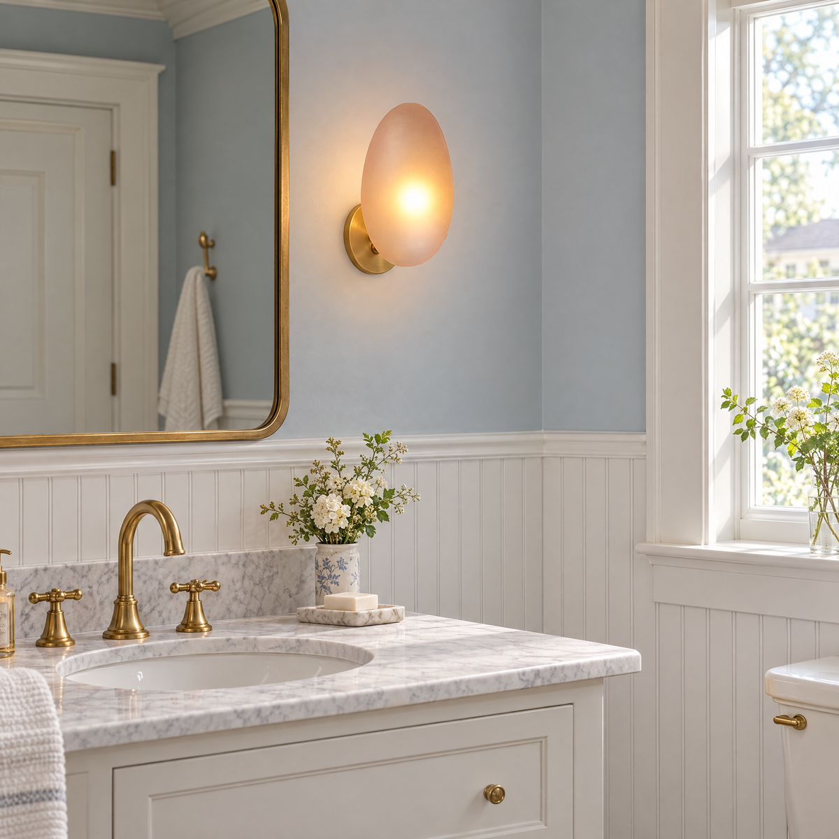 Opaline wall sconce in Amber & Gold, shape ∅8.6" x H13.7" in a New England colonial bathroom