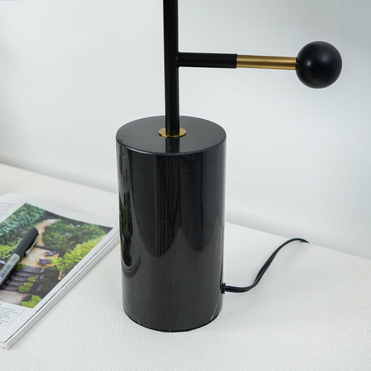 Barclay table lamp close up of the black stem and ball counterweight arm