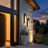 Aurelle wall light beside contemporary home entrance at dusk