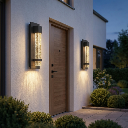 Pair of Perle sconces flanking modern front door at twilight