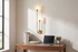 Gemini Dual Head LED Wall Sconce above a home office desk