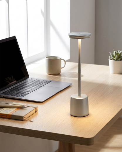 Lumen gray cordless LED table lamp on a home office desk