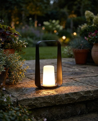 Marin black waterproof outdoor lamp on a courtyard step at night