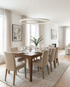 Halo white LED ring chandelier above a dining table