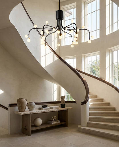 Lunova chandelier in black finish in a double-height entryway foyer
