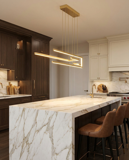 Seryn gold linear chandelier over a luxury kitchen island
