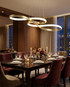 Lirelle gold ribbon pendant over an elegant dining table