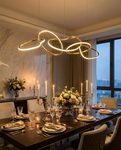 Halcyra gold circle chandelier over an elegant dining table