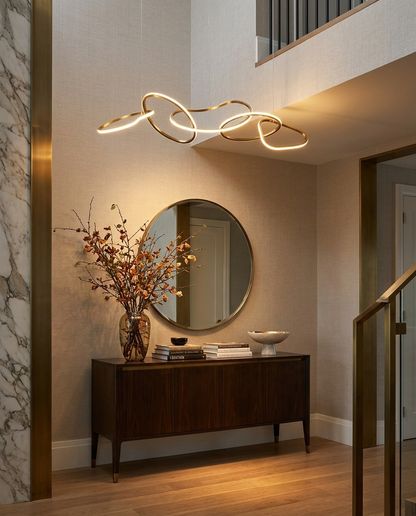 Halcyra gold circle chandelier in an upscale entryway