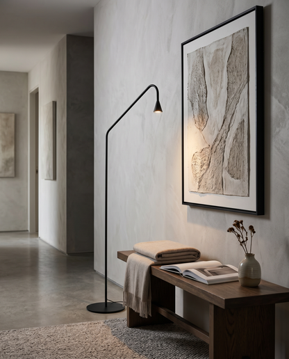 Black arc floor lamp in a hallway corridor