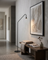 Black arc floor lamp in a hallway corridor
