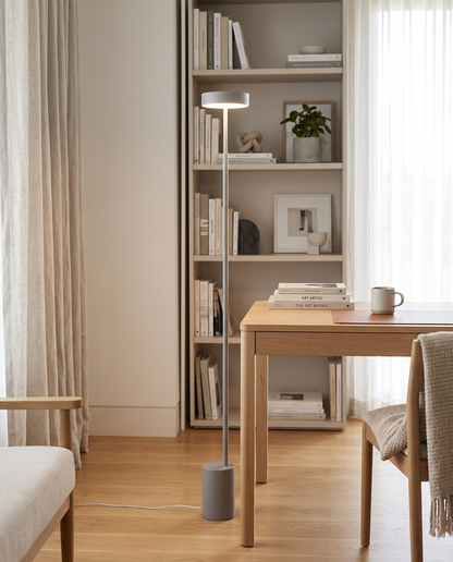Gray petite floor lamp in a bright home study