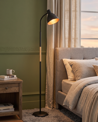 Black Alder wood arc floor lamp in a cozy bedroom