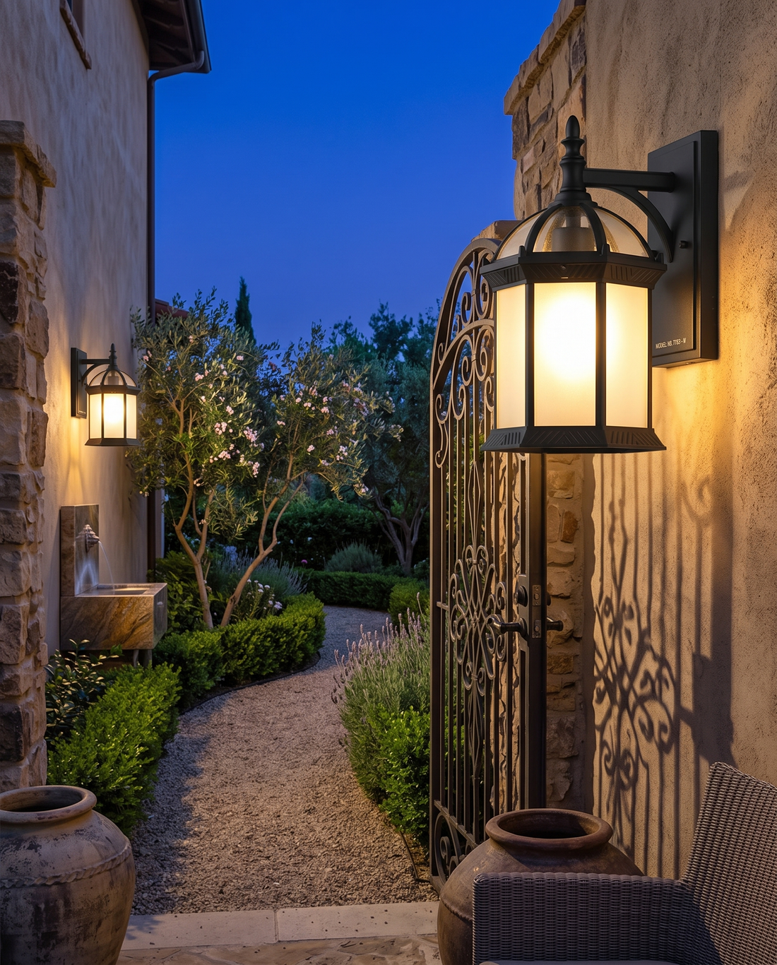 Wall-mount black patio sconce on a courtyard wall
