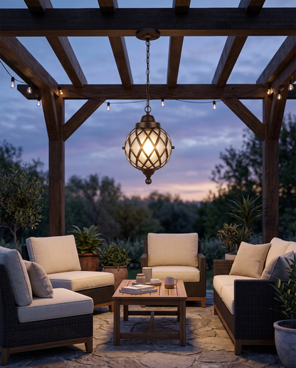 Bronze globe pendant light under a pergola