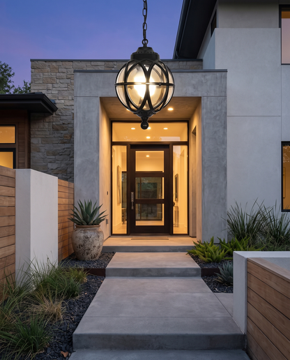 Black orb pendant light above front steps