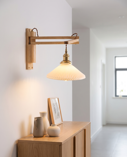 Bjork Glass Wall Sconce in Rubberwood in a hallway