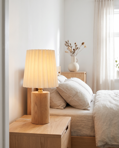 Seol Table Lamp in Wood on a bedroom nightstand