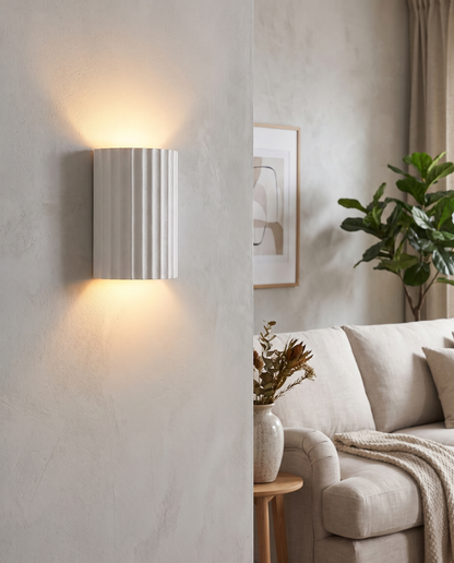 Momo Wall Sconce in White in a living room