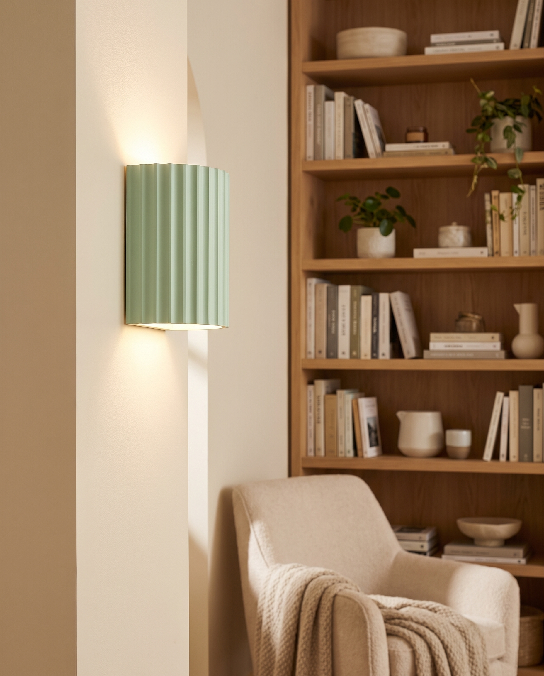 Momo Wall Sconce in Green in a bedroom