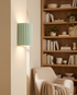 Momo Wall Sconce in Green in a bedroom