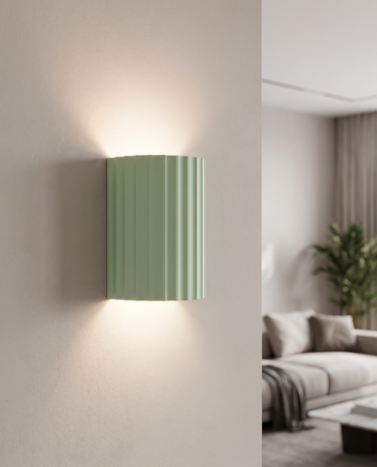 Momo Wall Sconce in Green in a reading nook