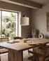 Onda Travertine Pendant Light over a dining table