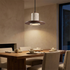 Noce Travertine Pendant over a dining table