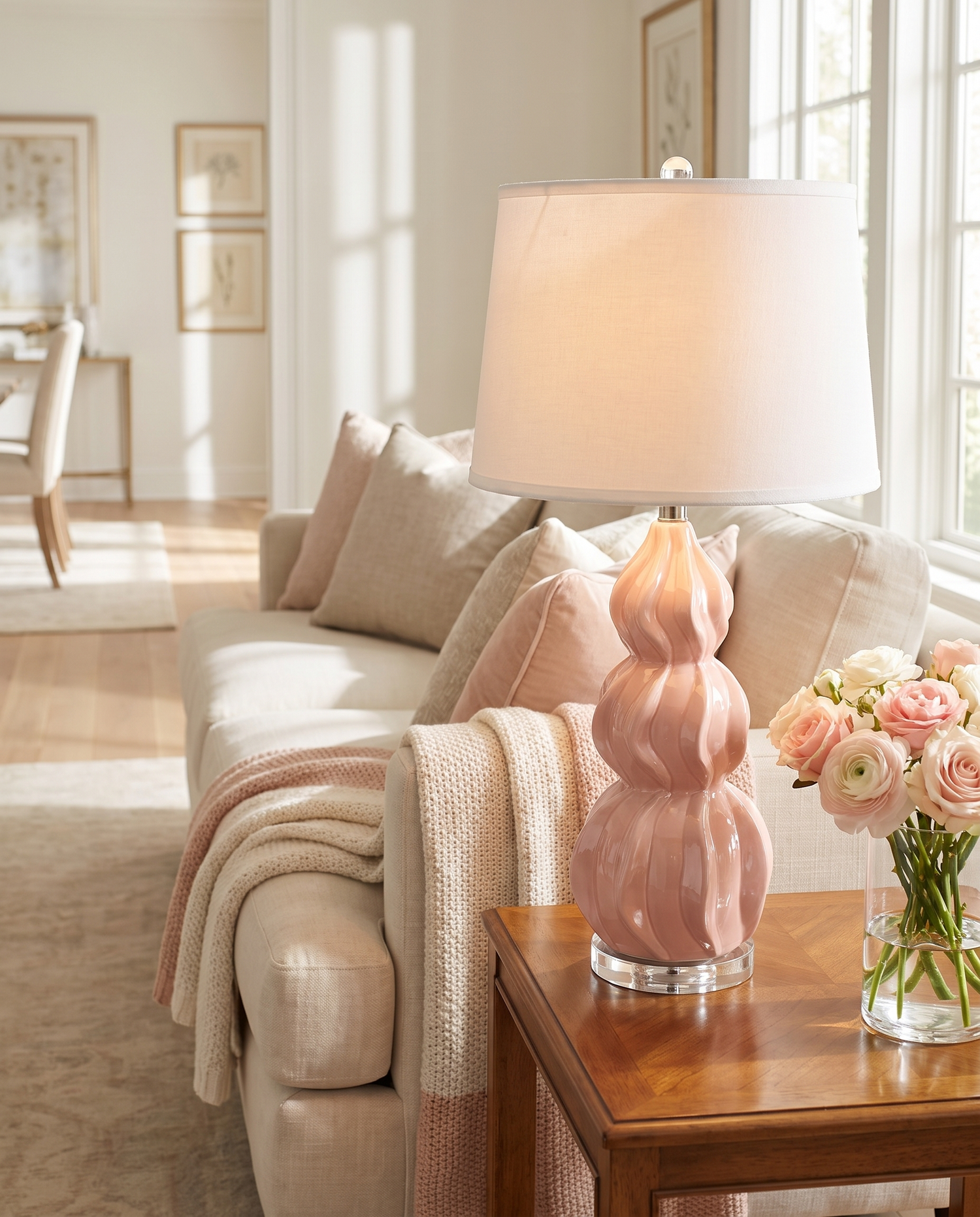 Juno pink ceramic gourd table lamp in a living room