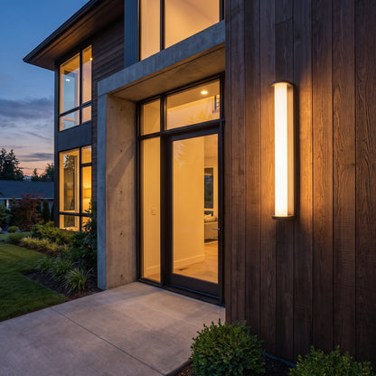 Lumira bronze tube outdoor wall sconce at a home entrance