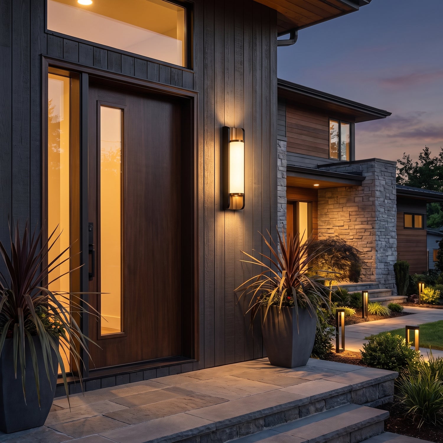Orin black and brass up and down outdoor sconce at a front door