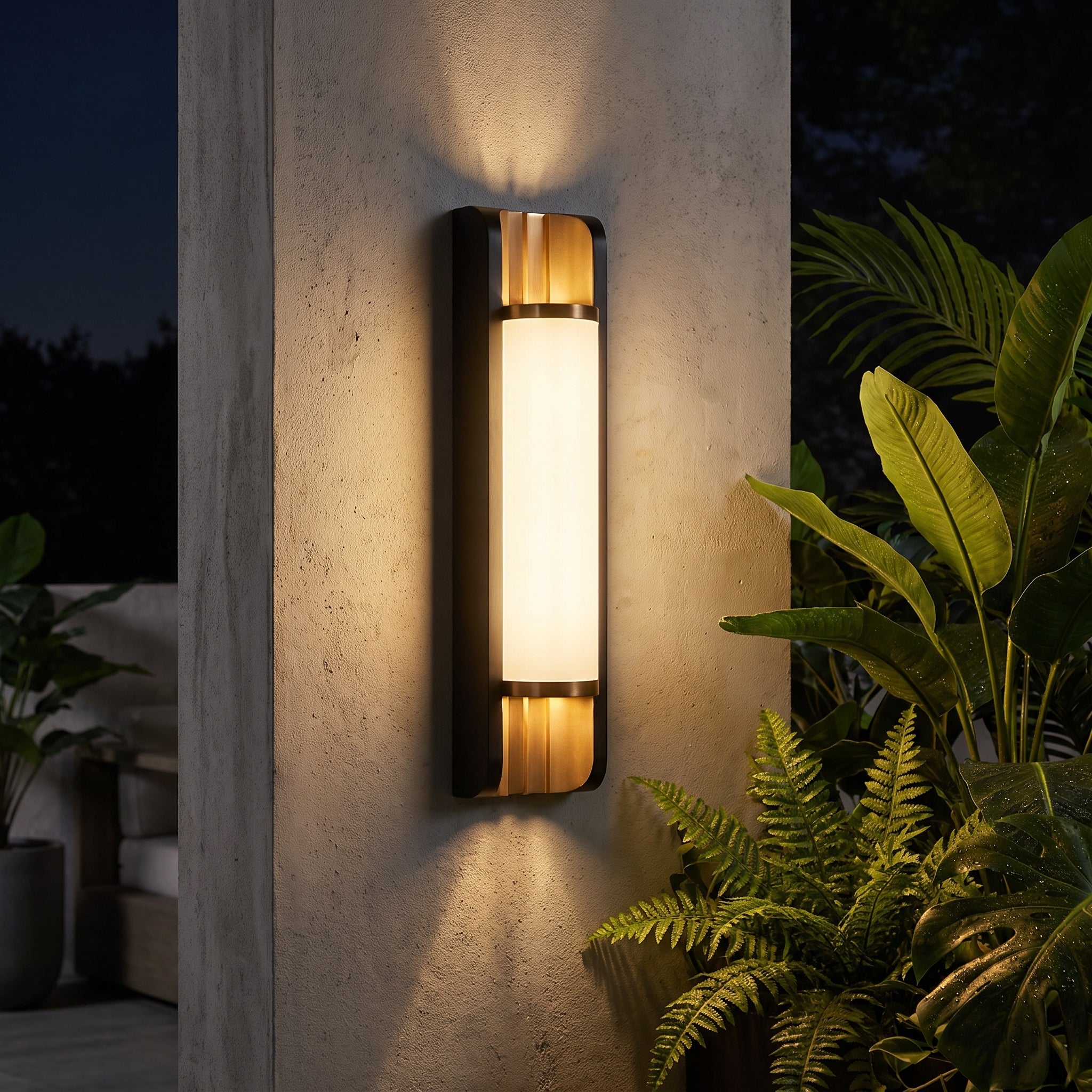 Orin black and brass up and down outdoor sconce on a patio wall