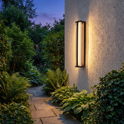 Celeste outdoor wall sconce on garden pathway wall