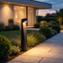 Fenn path bollard along modern garden walkway at dusk