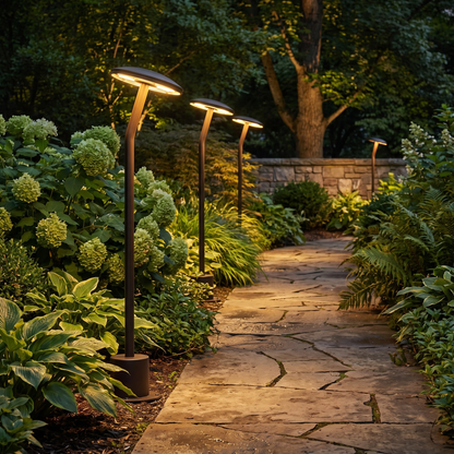 Bram bronze path light along garden pathway at night