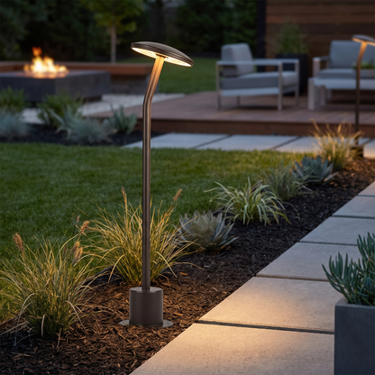Bram bronze path light along modern lawn edge