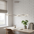 Tessa gray interwoven wave pendant light over a Scandinavian home office desk