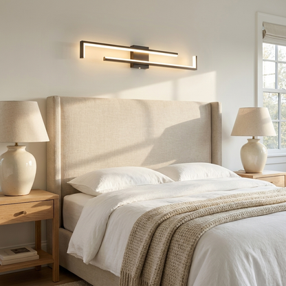 Ermont black long bar wall light above a headboard in a bright primary bedroom