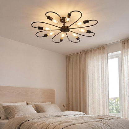 Daisy black iron flower ceiling light above a calm bedroom with linen bedding