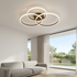 Cirque three ring LED flush mount ceiling light in a minimalist living room