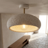 Willa terrazzo speckled dome ceiling light in a stone floored entry