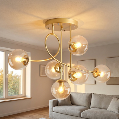 Lenore gold chandelier with cognac glass globes in a Nordic living room