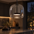 Orbe Hand Blown Glass Pendant Light in Black and Smoke Grey, close-up above a kitchen island