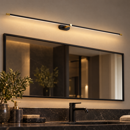 Strata Linear LED Vanity Wall Light in Black and Gold, close-up above a mirror
