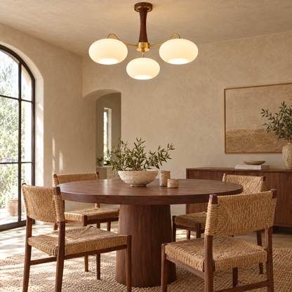 Kaki Brass and Wood Chandelier in Brass and Walnut above a round dining table