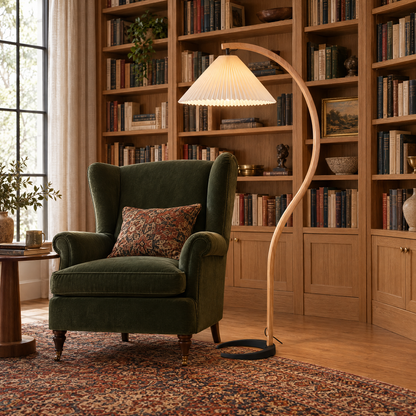 Caprani Beech Wood Linen Floor Lamp with Beige shade in a home library