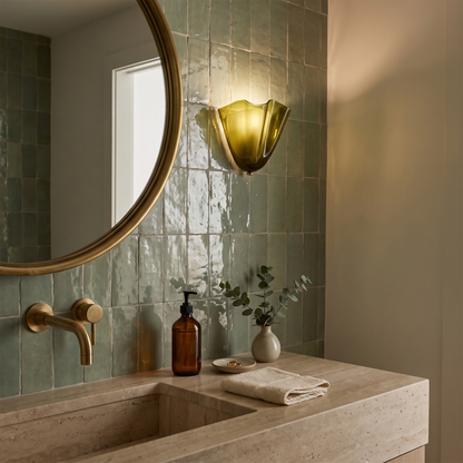 Petalia Green glass wall sconce in a bathroom vanity