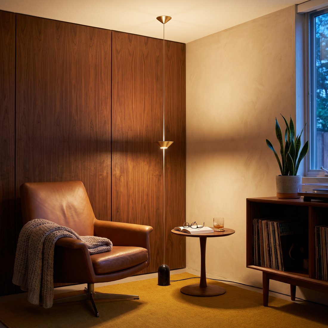 Soreluna 1 Light floor to ceiling LED floor lamp in a mid-century reading nook