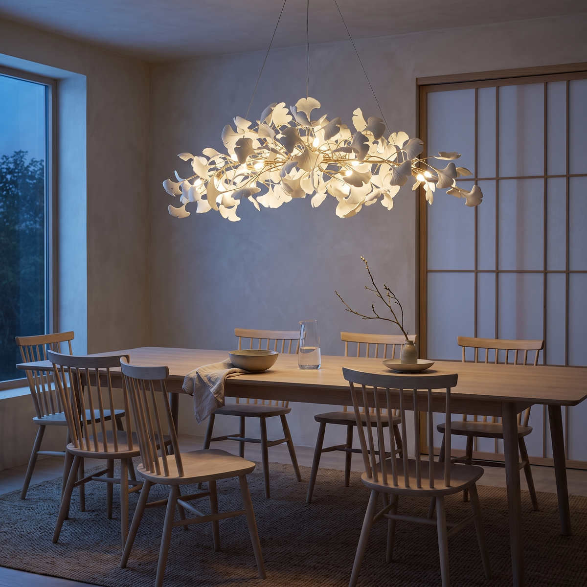 Icho Gold linear ginkgo leaf chandelier in a Japandi dining room